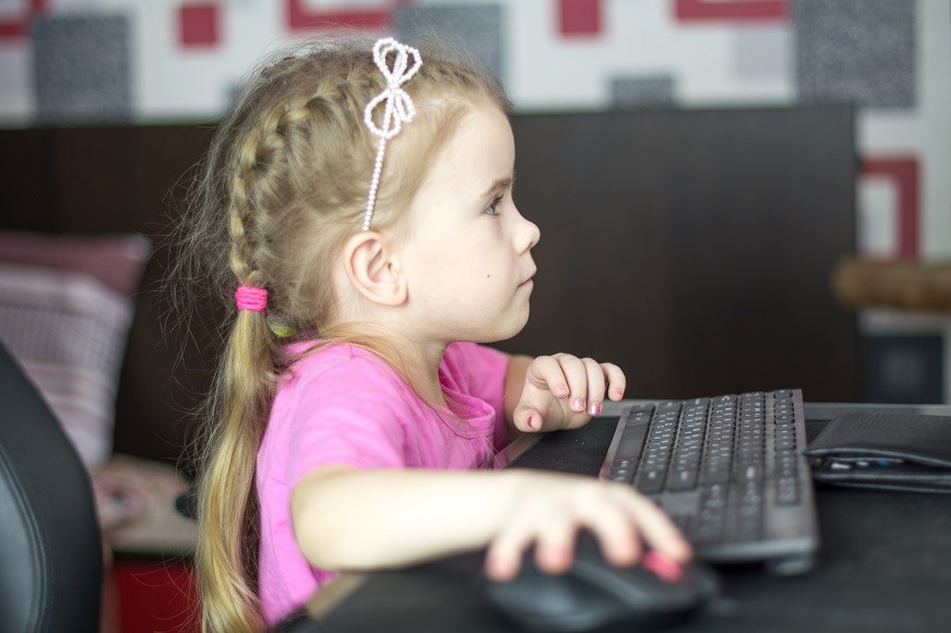 Girl sitting at computer