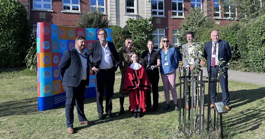 Group next to World Social Work Day tree