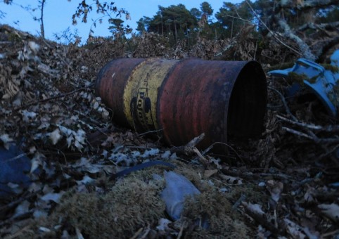 Waste barrel and other waste on land