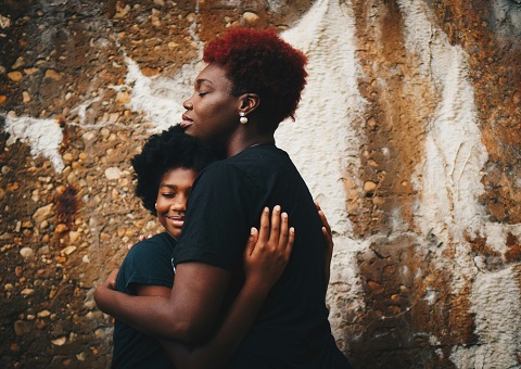 Mother and son hugging