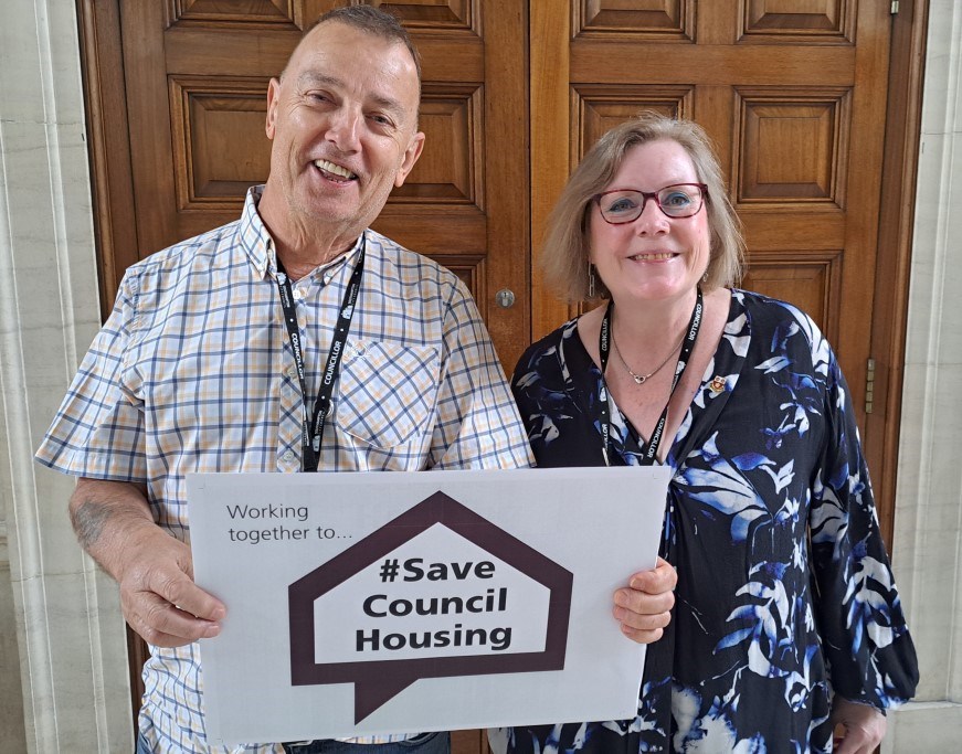 Councillors holding poster saying 'Working together to... #Save Council Housing'