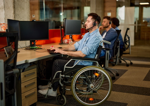 Someone at a desk in a wheelchair