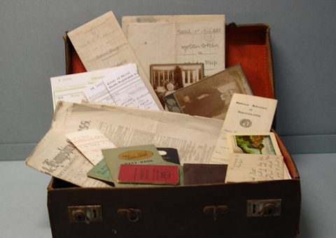 Old paper records inside a box