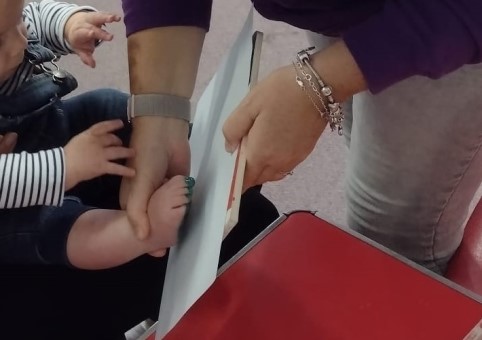 Taking a stamp of a child's feet