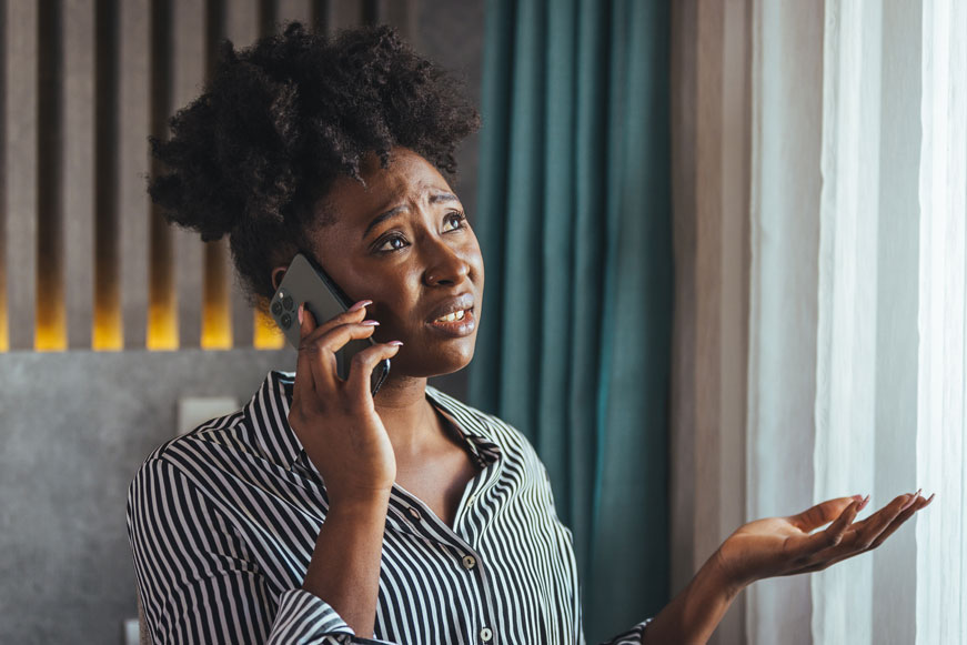 A Woman Making A Complaint By Telephone